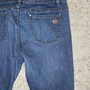 Michael Kors cropped distressed jeans.